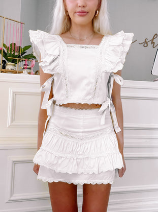 Model wearing sun ruffle set from sassy shortcake