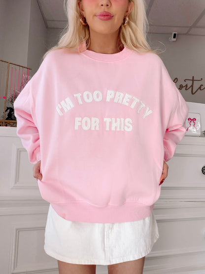 I'm Too Pretty For This Pink Crewneck from Sassy Shortcake - Person wearing a pink sweatshirt with text in a room.