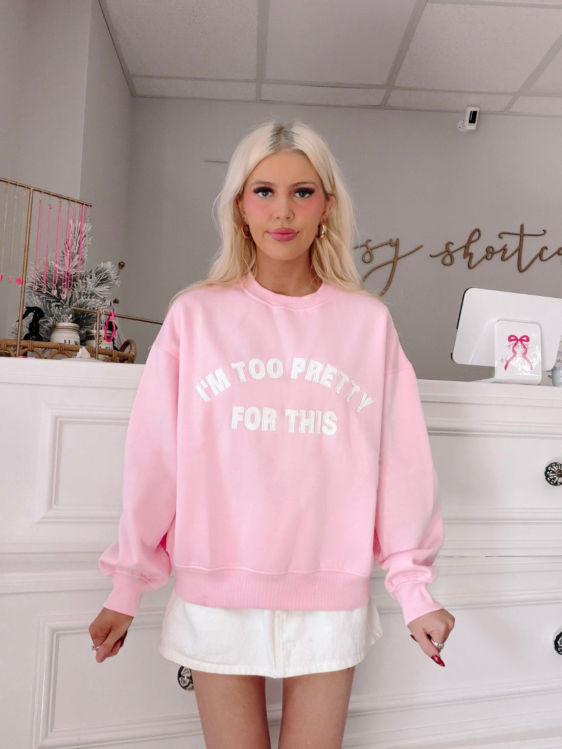 I'm Too Pretty For This Pink Crewneck from Sassy Shortcake - Person wearing a pink sweatshirt with text.