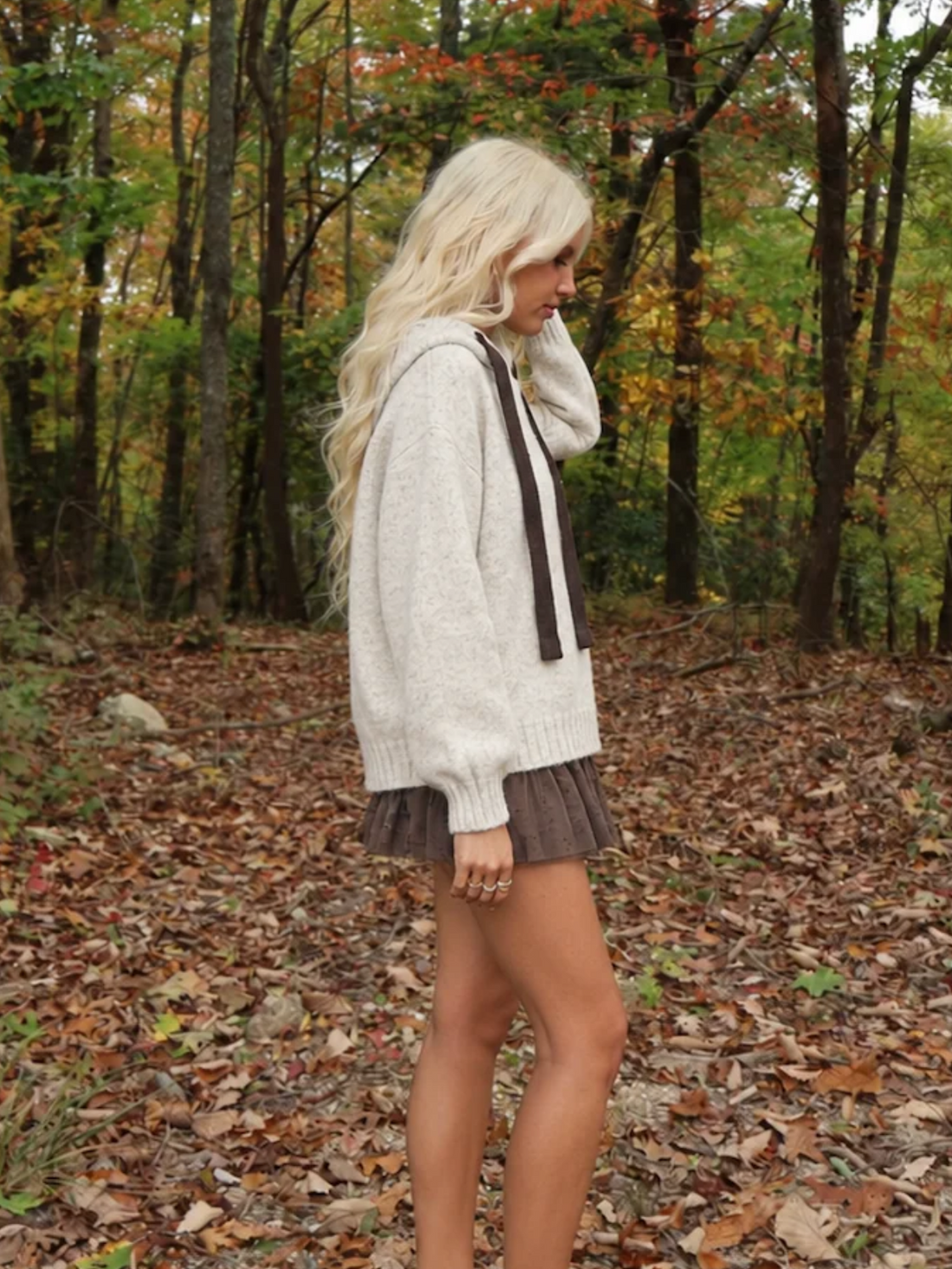 Side view of the Sassy Shortcake Truffle Tulle Skirt showing the full, flouncy layers of the brown tulle mini skirt.
