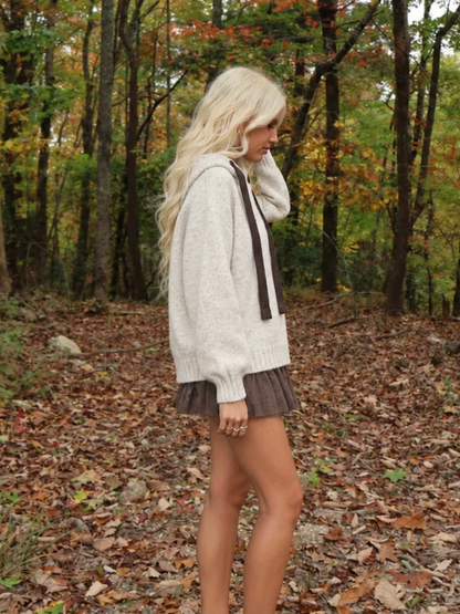 Side view of the Sassy Shortcake Truffle Tulle Skirt showing the full, flouncy layers of the brown tulle mini skirt.
