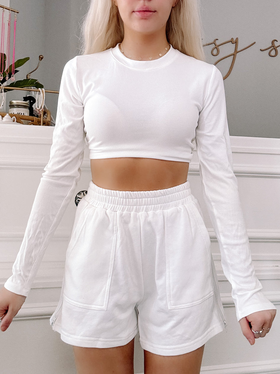 White Zoey Zip Shorts: comfy, casual white shorts with side zippers.
