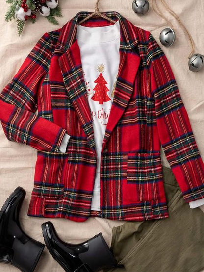 Red and green plaid blazer styled with olive green pants and black rain boots.
