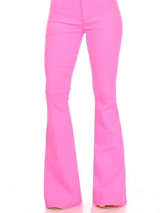 Hot pink flare jeans shown from the knees down, against a white background.