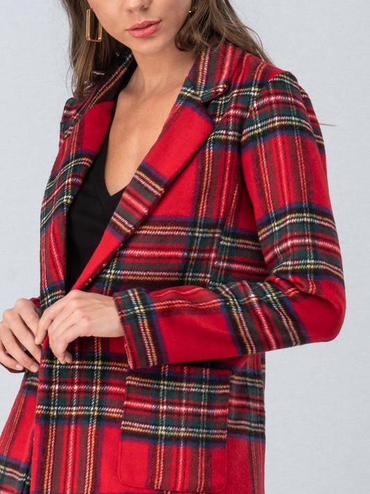Red and green plaid blazer, close-up showing texture and detail.
