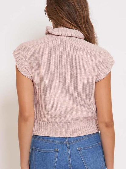 Pink knit short-sleeve cropped sweater, mock turtleneck.
