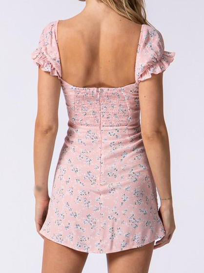 Pink floral mini dress with ruffled short sleeves and a square neckline, shown from the back.

