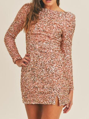 Rose gold sequin mini dress with long sleeves and side slit, perfect for parties.

