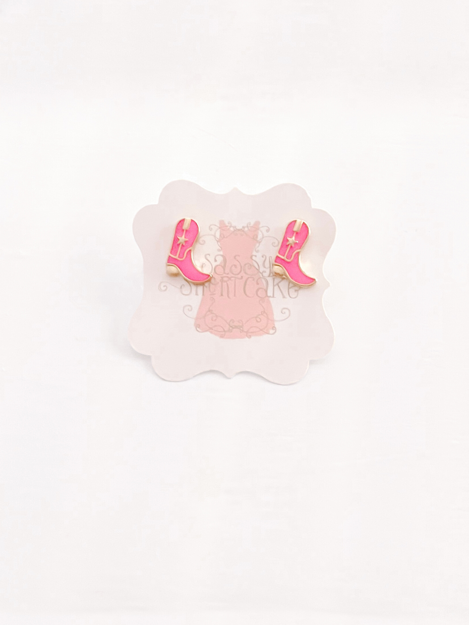 Pink boot stud earrings; gold accents.
