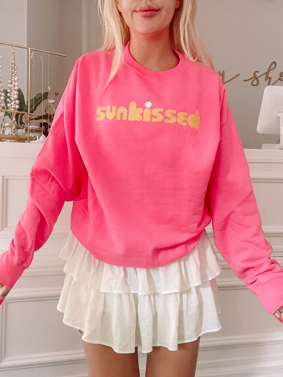 Hot pink Sunkissed sweatshirt with gold lettering
