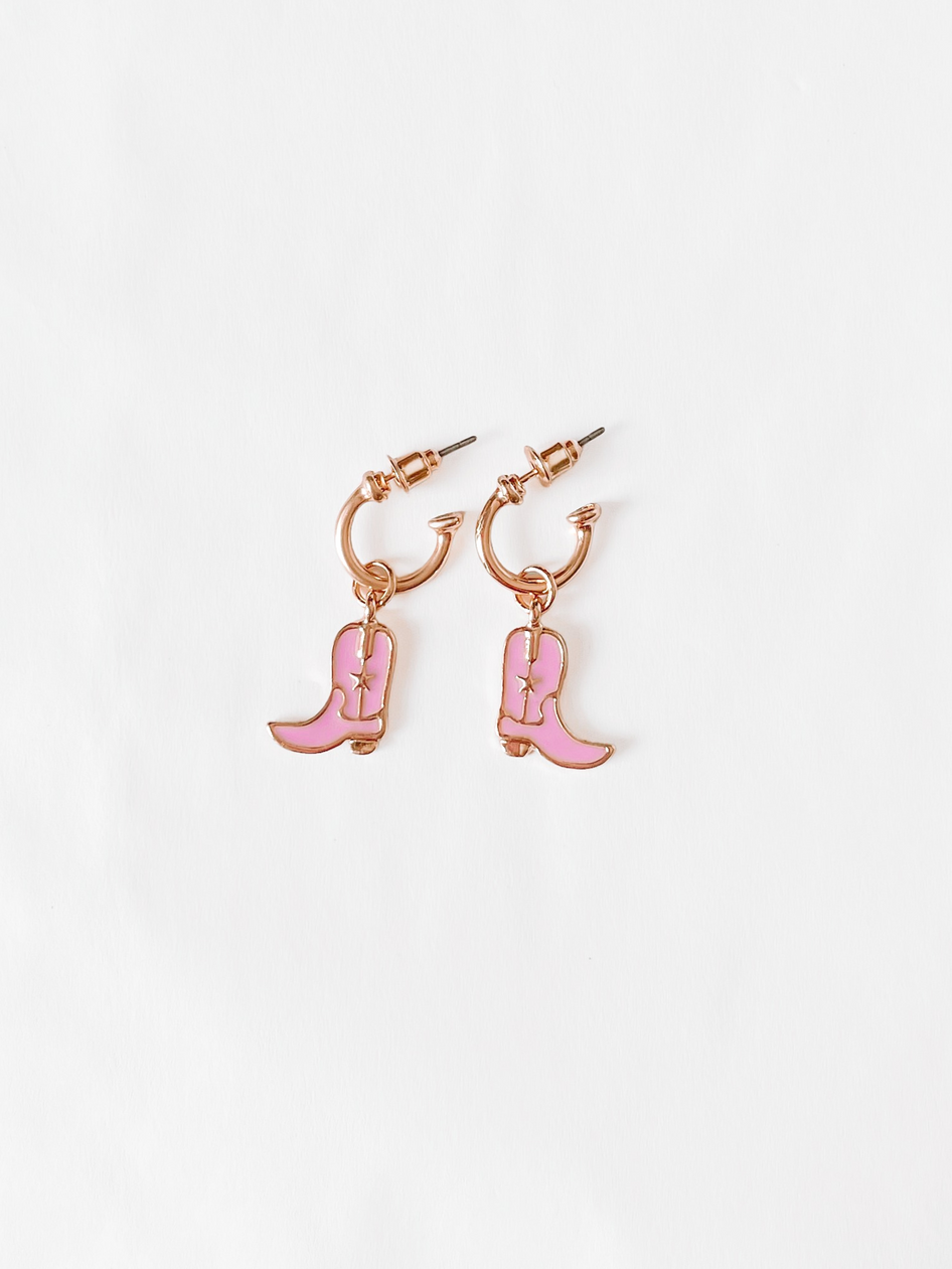 Pink rodeo boot earrings: rose gold hoops with pink enamel boots.
