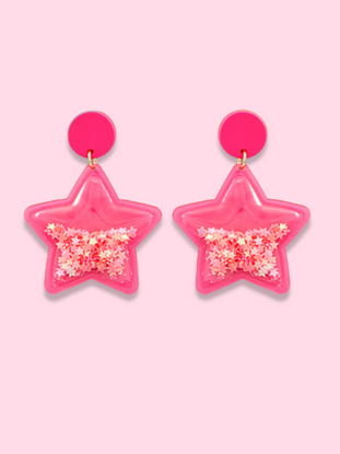 Pink star-shaped earrings with pink glitter inside.
