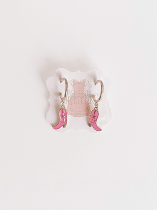 Hot pink rodeo boot earrings; gold hoops with pink enamel boots.
