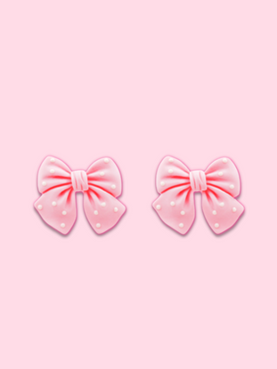 Polka Pink Bow earrings: Pink bow-shaped earrings with white polka dots.
