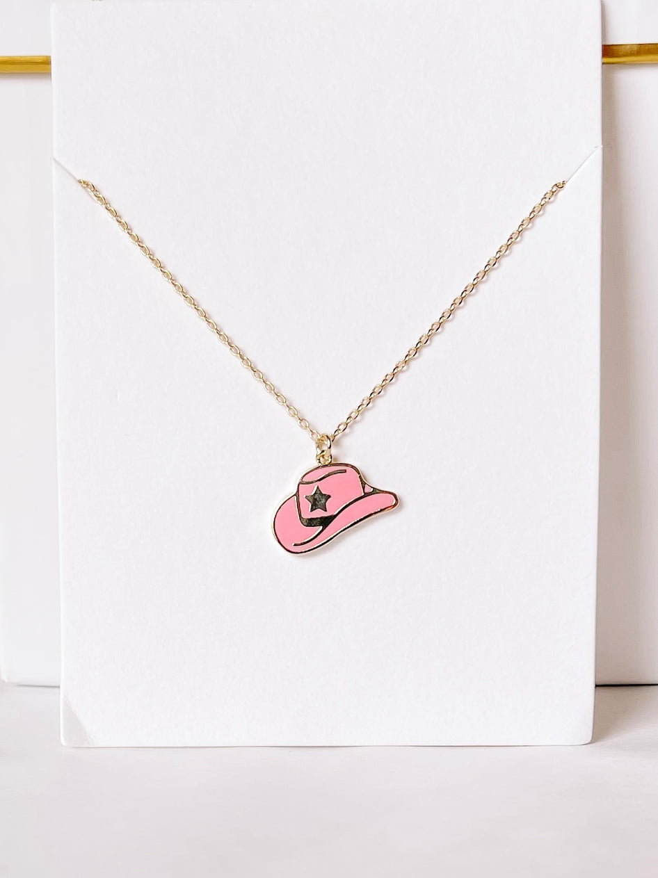 Gold chain necklace featuring a pink cowboy hat charm.
