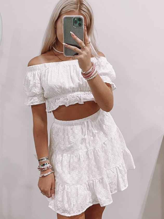 White eyelet off-shoulder crop top and tiered mini skirt set
