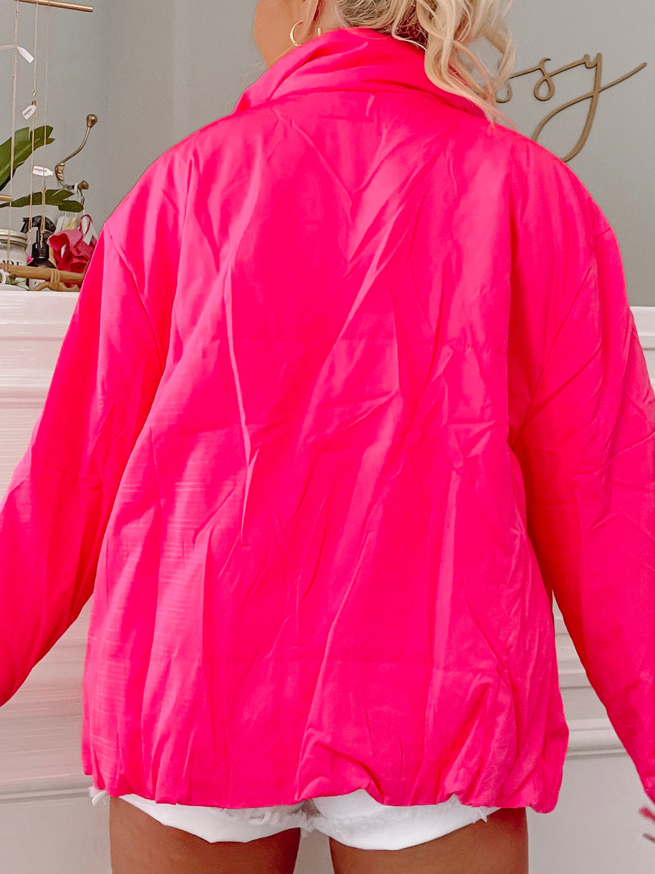 Hot pink jacket shown from behind, lightweight fabric with cinched waist.
