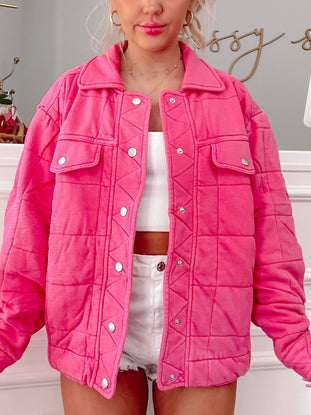 Landry quilted jacket in hot pink, featuring a button-front closure and diamond quilting.
