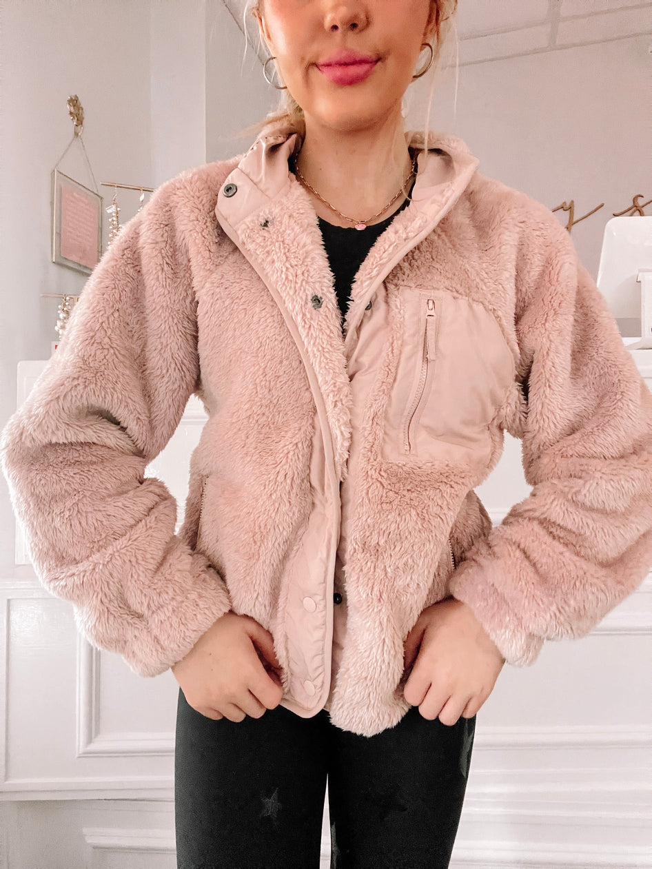Felice Jacket: Blush pink fluffy fleece jacket with zip and snap closure.
