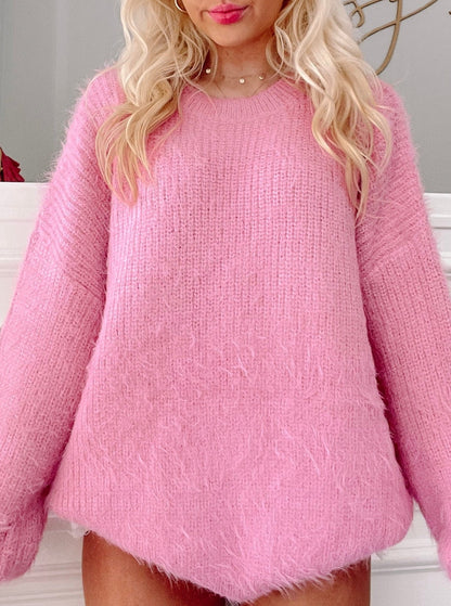 Fuzzy pink sweater, relaxed fit, shown on model.
