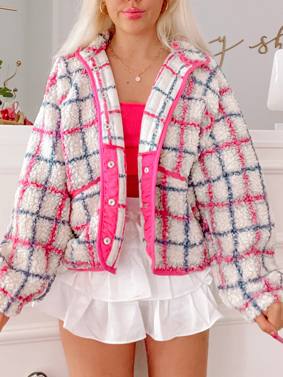 Cream, pink & blue plaid teddy jacket; fluffy texture, bright pink interior.
