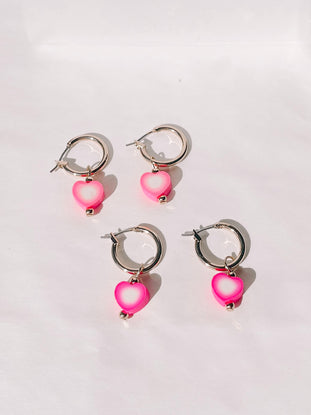 Pink and white heart charm gold hoop earrings
