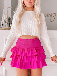 Runway Ruffles Skirt in Orchid:  Fuchsia tiered mini skirt with smocked waist.
