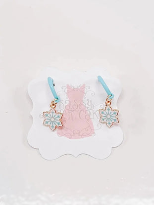 Ice Snowflake earrings with light blue hoops and gold snowflake charms.
