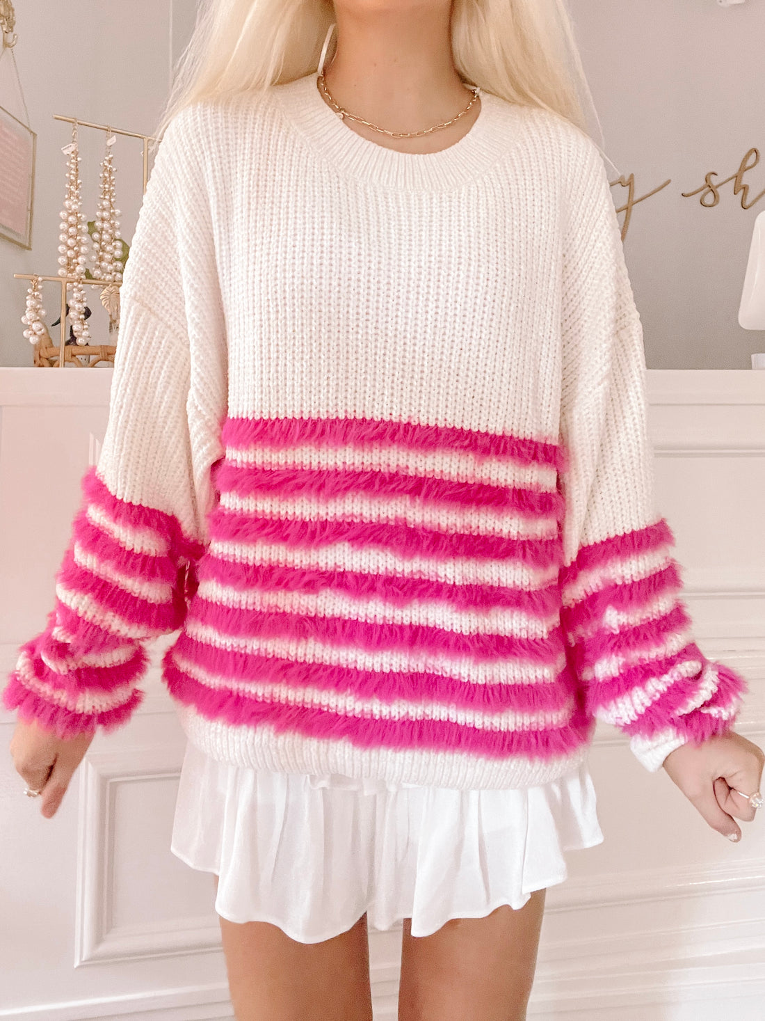 Cream knit sweater with hot pink fuzzy striped detail
