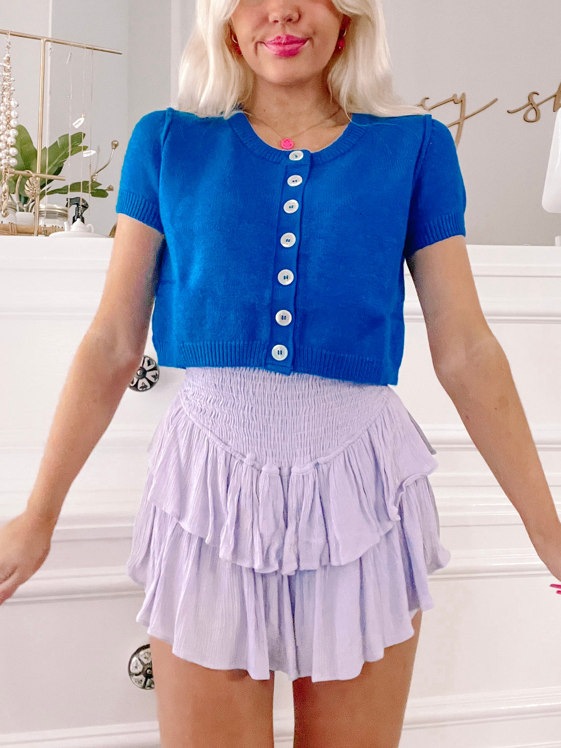 Royal blue Kallie cardigan with short sleeves and button front.
