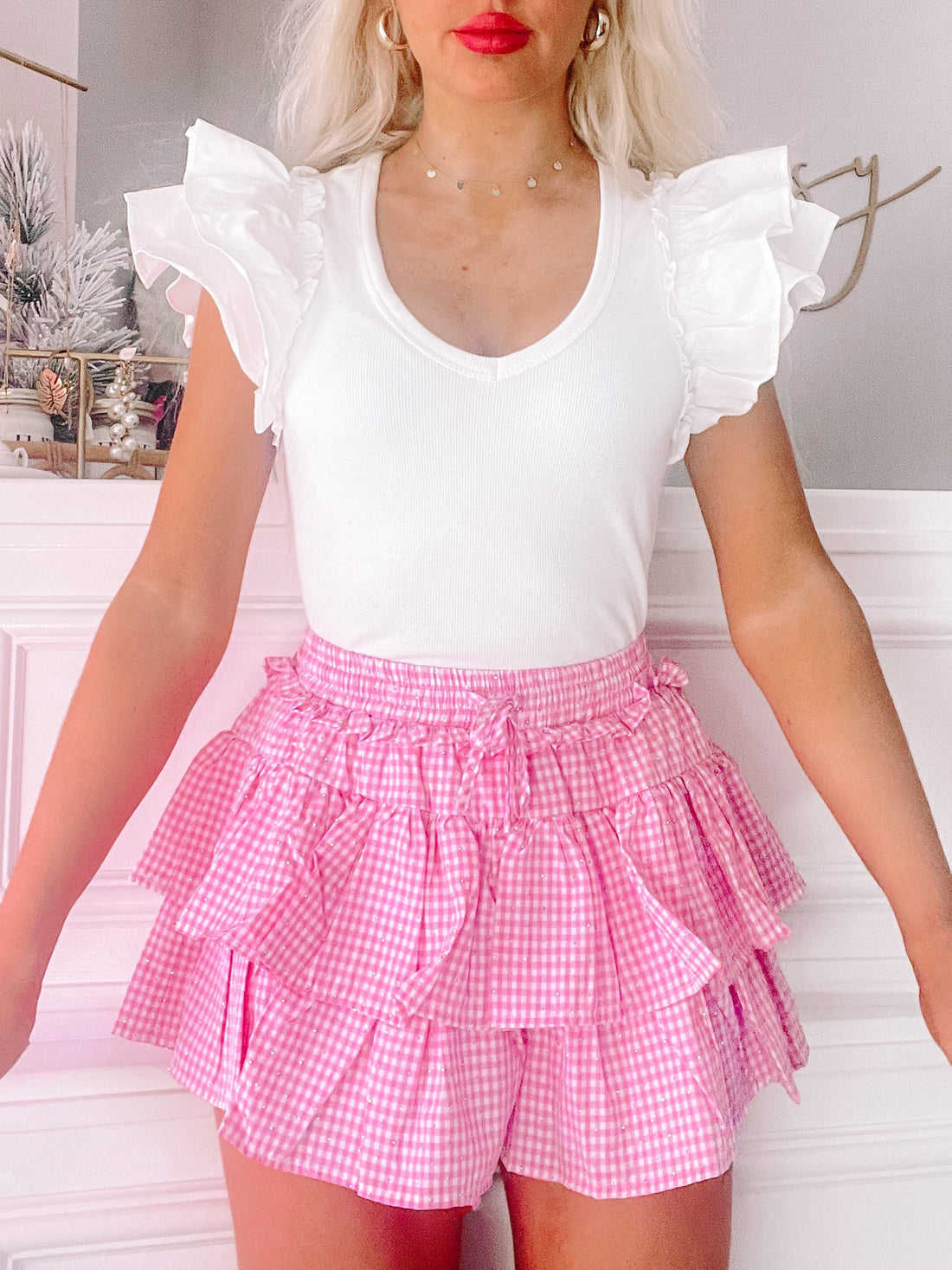 Pink gingham rhinestone skirt with ruffled layers.
