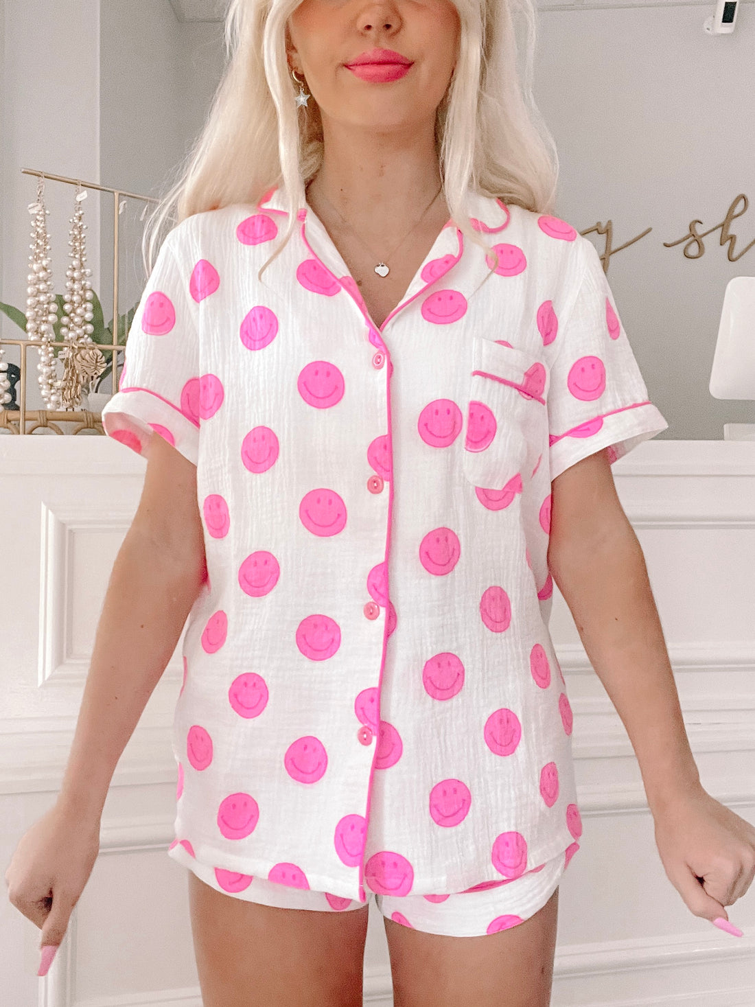 Smiley Dreams short set in pink: comfy white pajama set with pink smiley face pattern.
