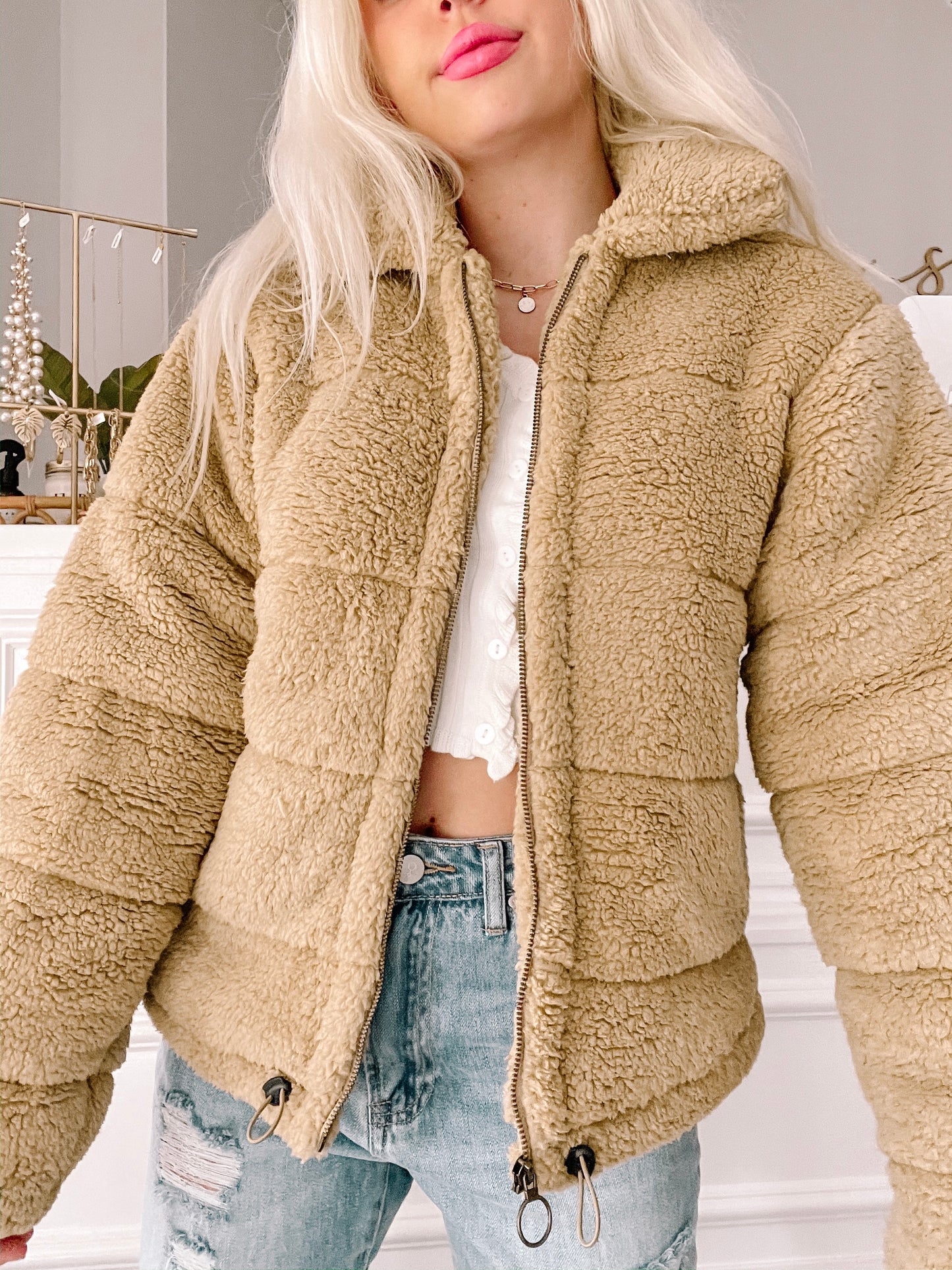 Tan teddy bear fleece zip-up jacket; soft, cozy winter outerwear.
