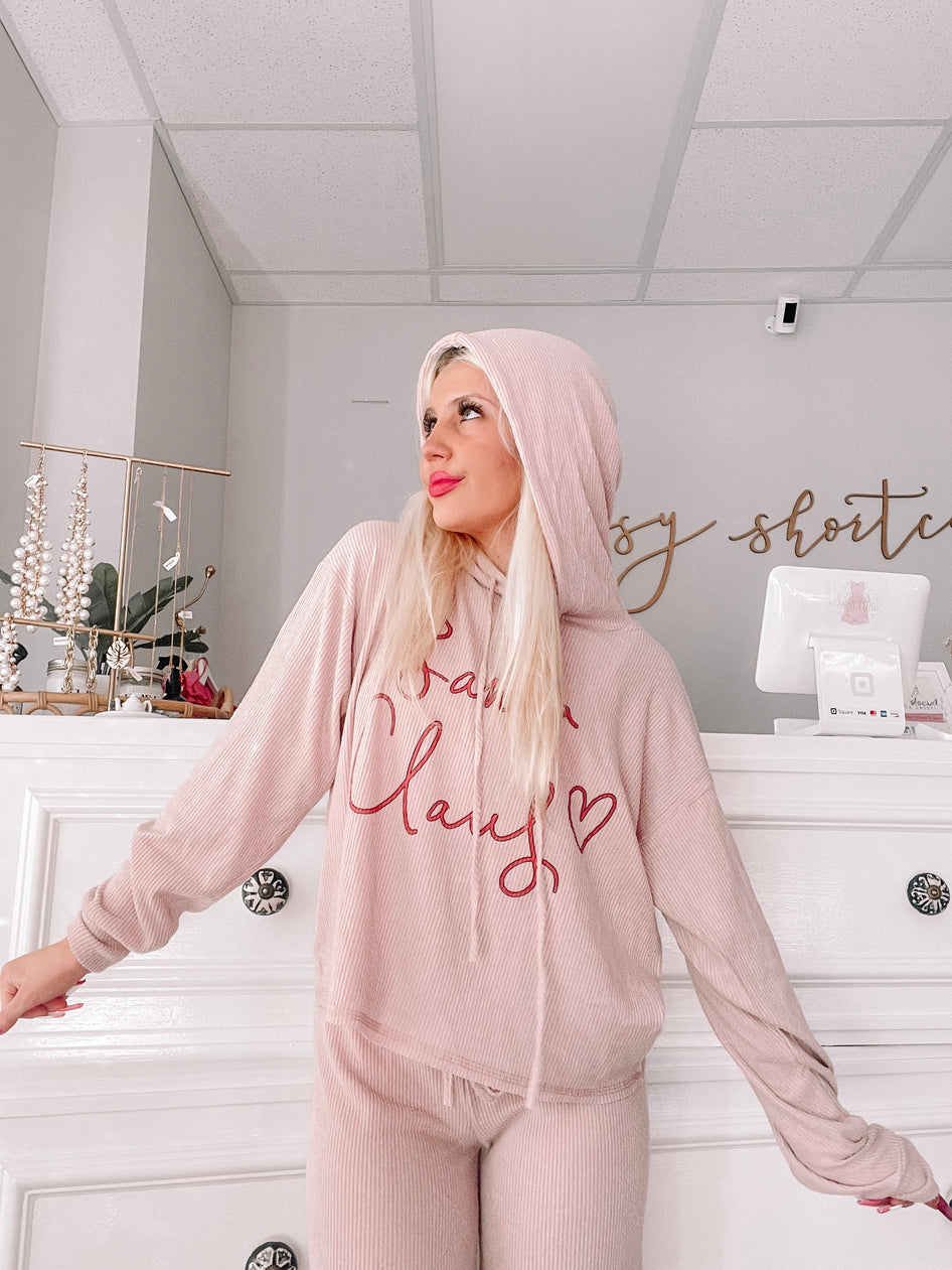 Pink ribbed knit pajama set with a hoodie featuring a red cursive design.
