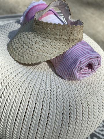 Woven straw visor for sun protection, perfect for beach days.
