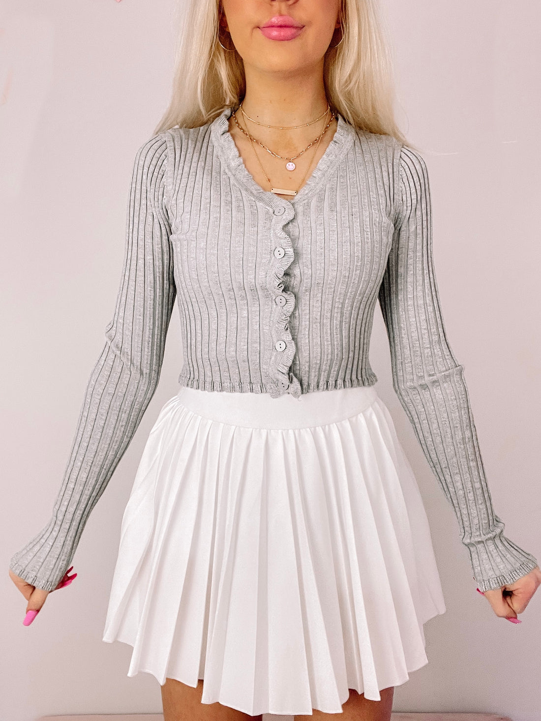 Gray ribbed knit cropped cardigan with scalloped button details

