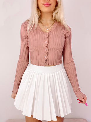 Mauve ribbed knit button cardigan, long sleeves, cropped fit.
