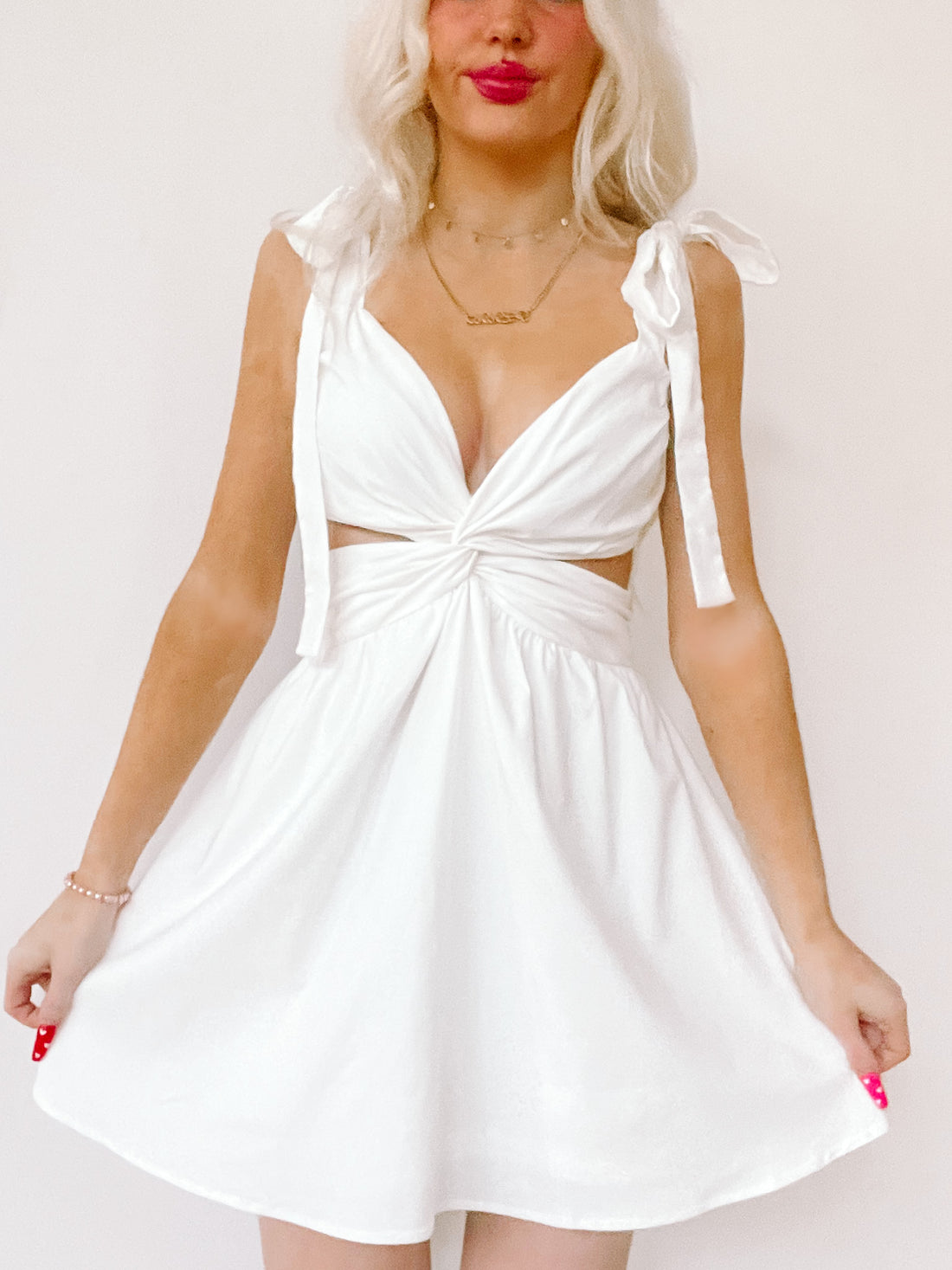 White Got Me Twisted dress with a twisted front and tie straps.
