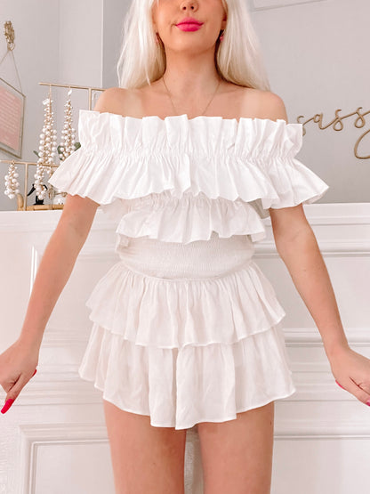 White off-the-shoulder ruffle top and tiered mini skirt set
