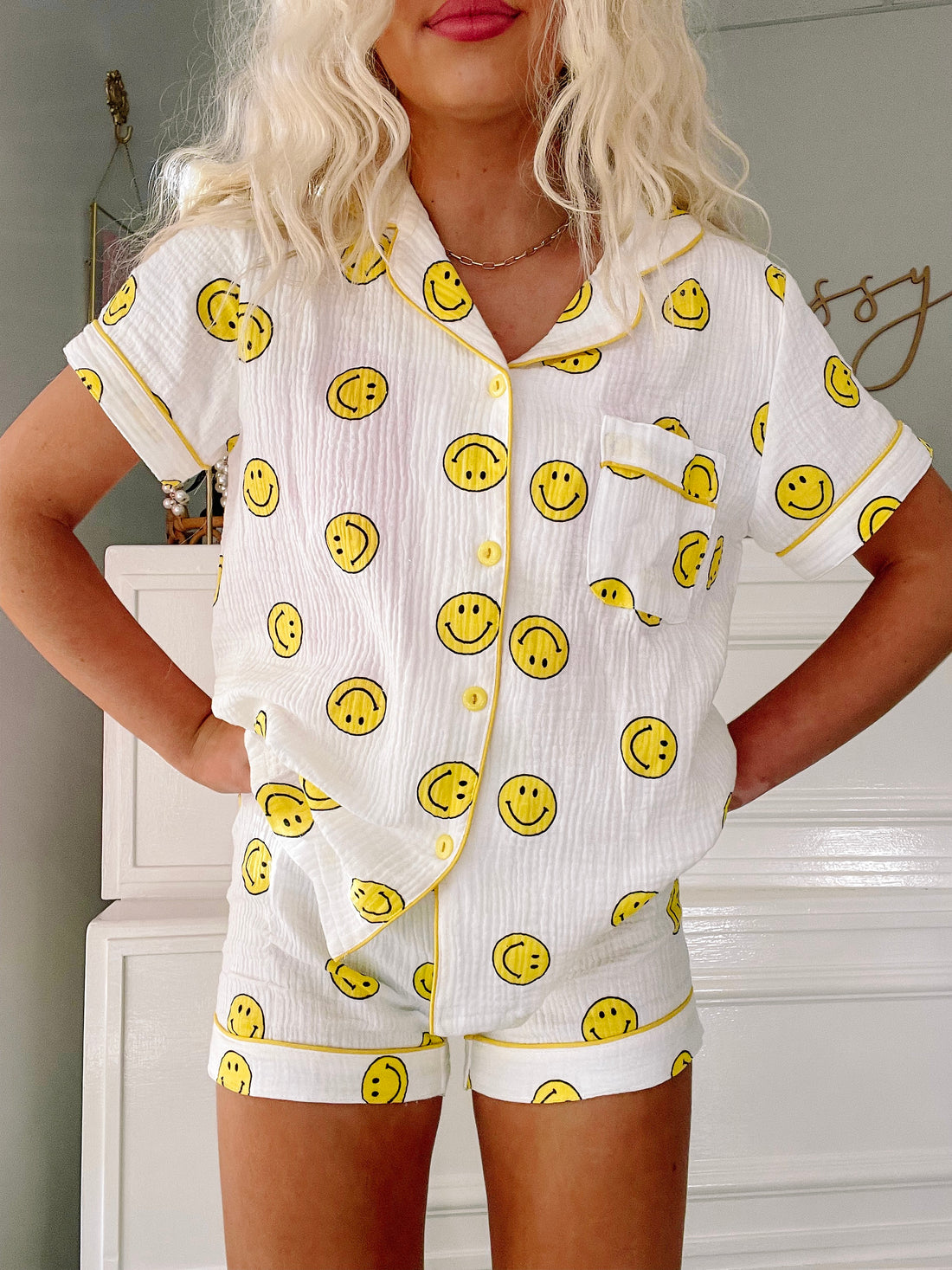 Smiley Dreams short set: White cotton pajama set with yellow smiley face print, perfect for comfy sleep.
