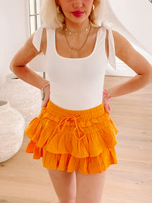 Marigold orange flirty ruffle mini skirt
