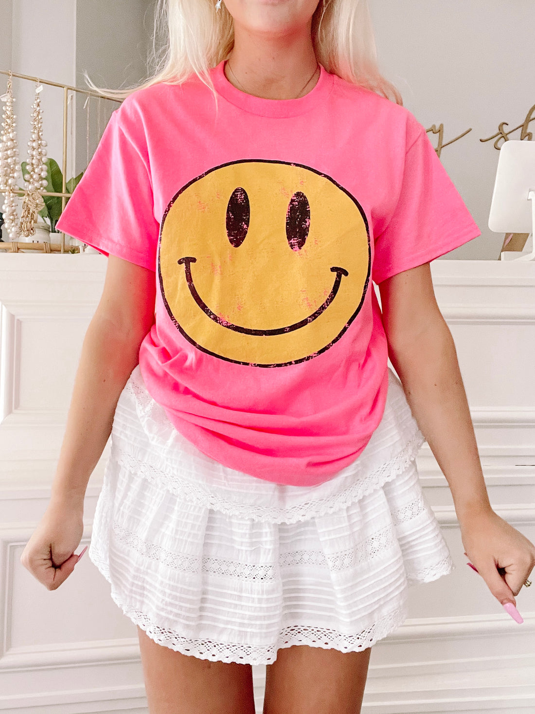 Pink Frown Upside Down tee with yellow smiley face graphic
