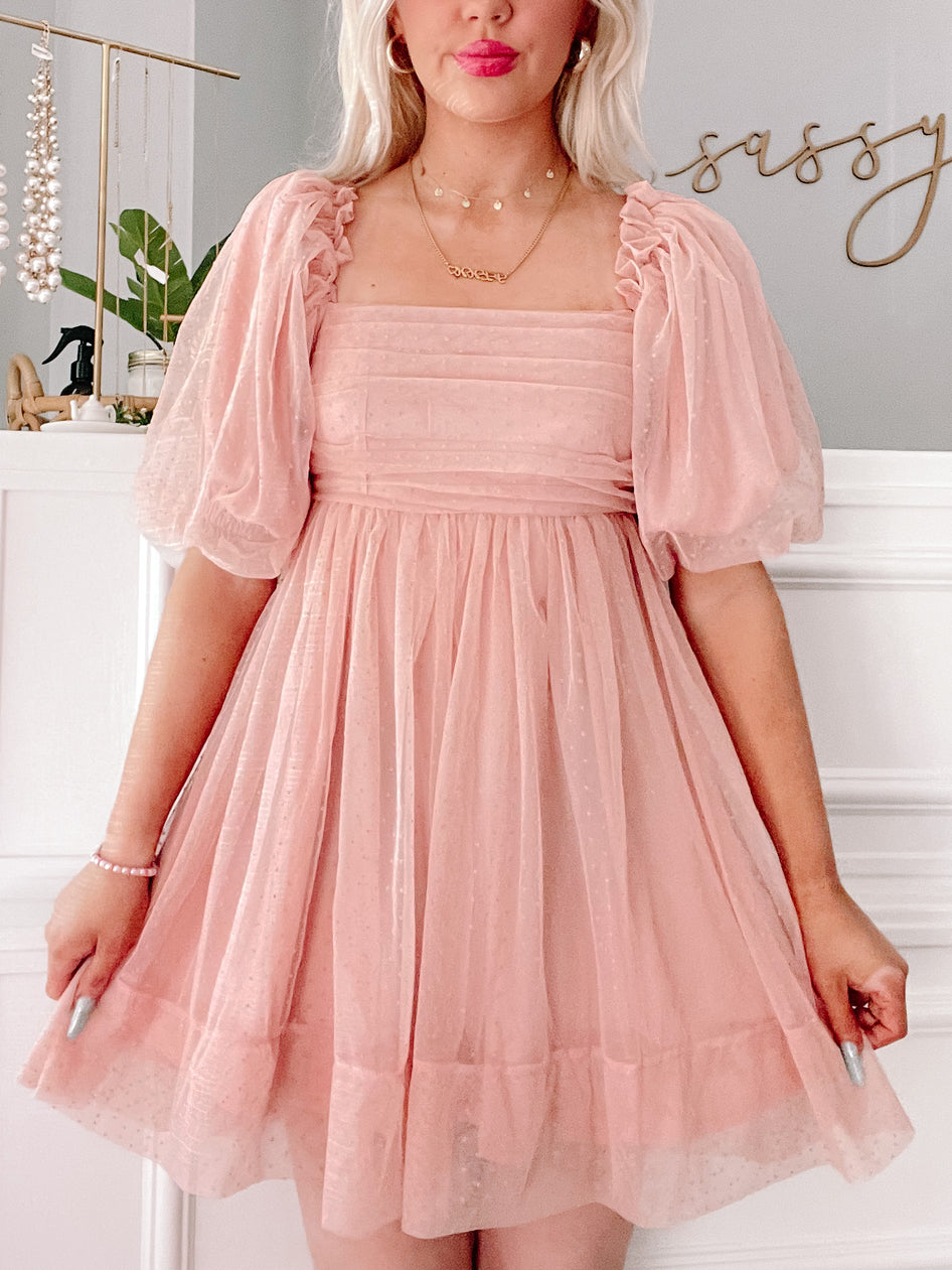 Pink Princess Blush puff-sleeve mini dress with subtle sparkle.
