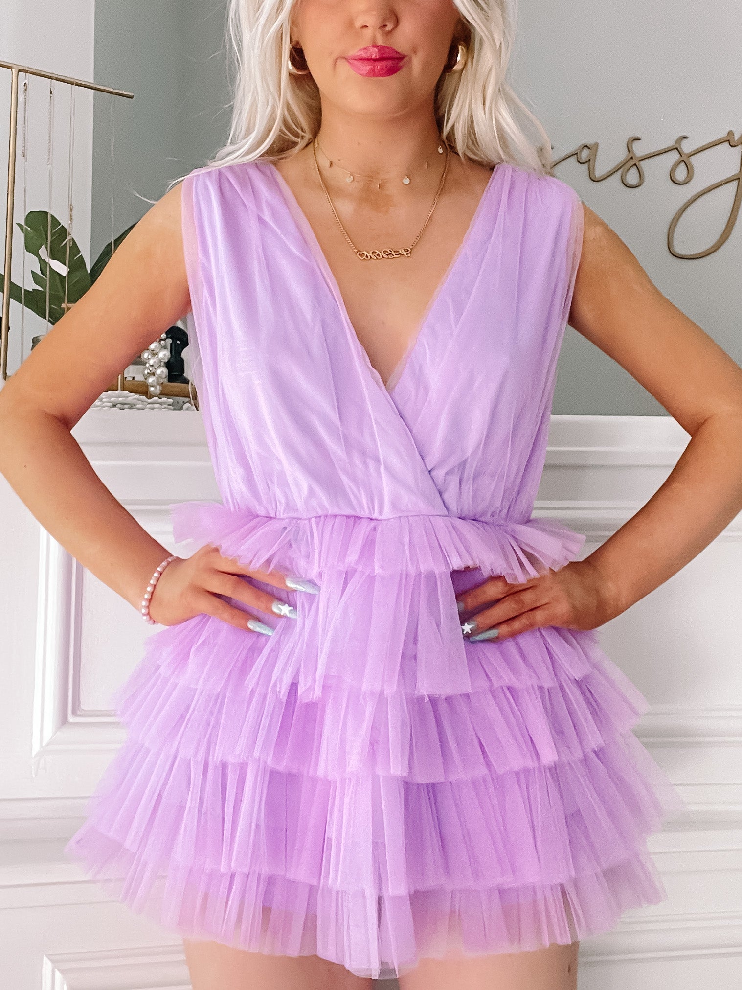 Lavender tulle romper with layered ruffle detailing, shown on model.
