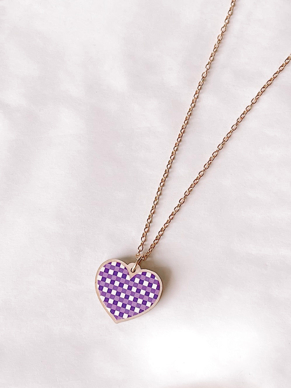 Gingham Love Necklace, Violet: Purple gingham heart pendant on gold chain.
