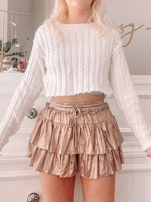 Golden Lilac Flirtatious Shimmer Skirt:  Shimmering gold, tiered ruffle mini skirt with drawstring waist.

