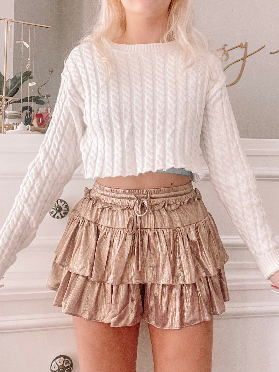 Golden Lilac Flirtatious Shimmer Skirt:  Shimmering gold, tiered ruffle mini skirt with drawstring waist.
