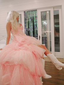 Pink tulle Once Upon A Time dress with silver stars, shown with white boots.
