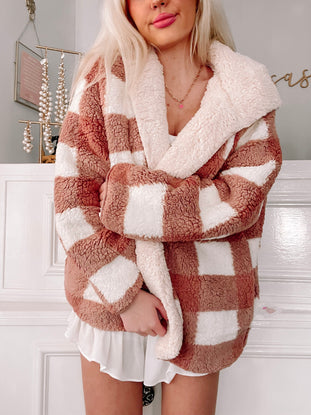 Cozy mauve and cream buffalo plaid teddy jacket, worn indoors.
