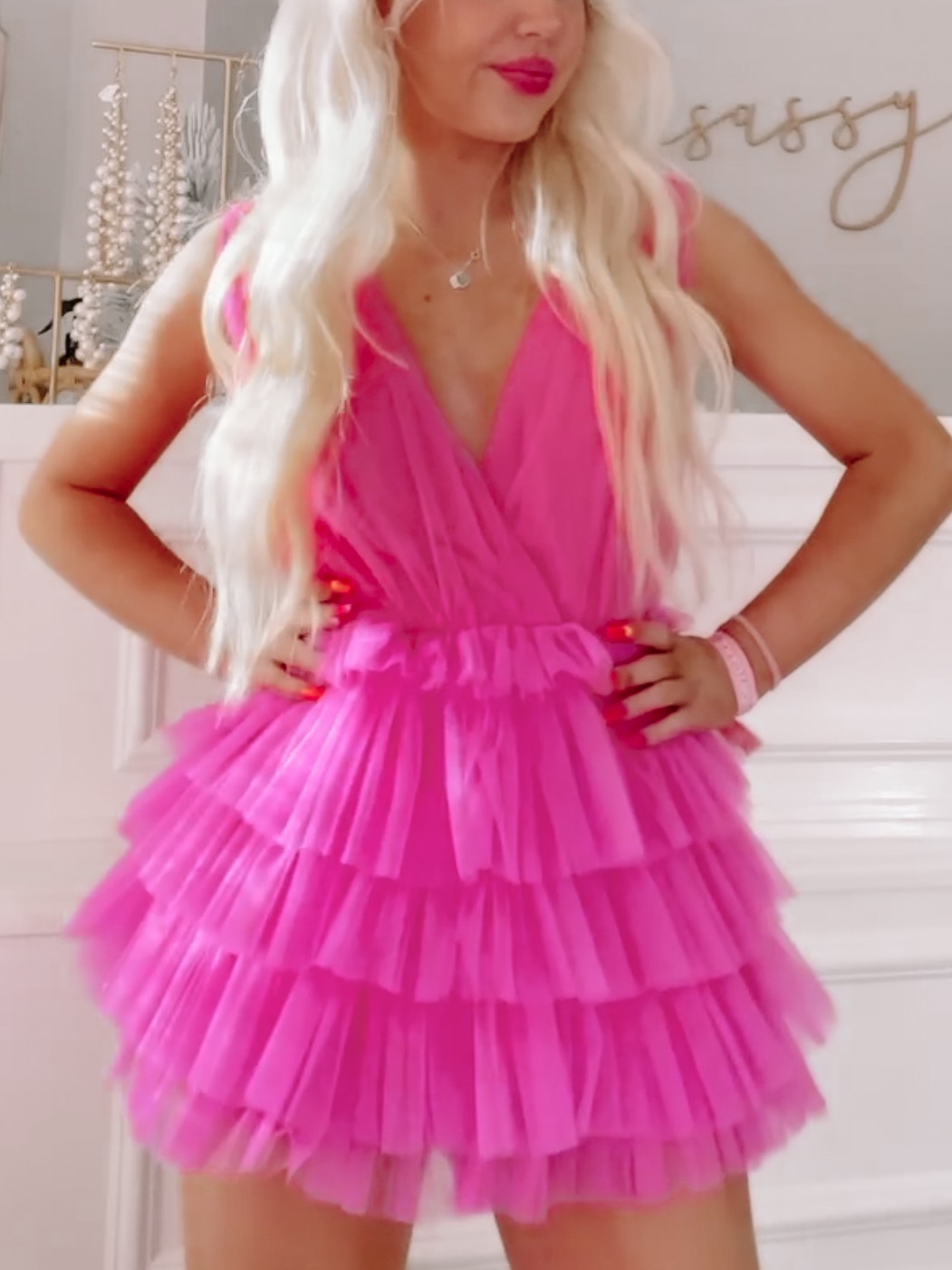 Hot pink tulle romper with tiered ruffle skirt; perfect for parties.
